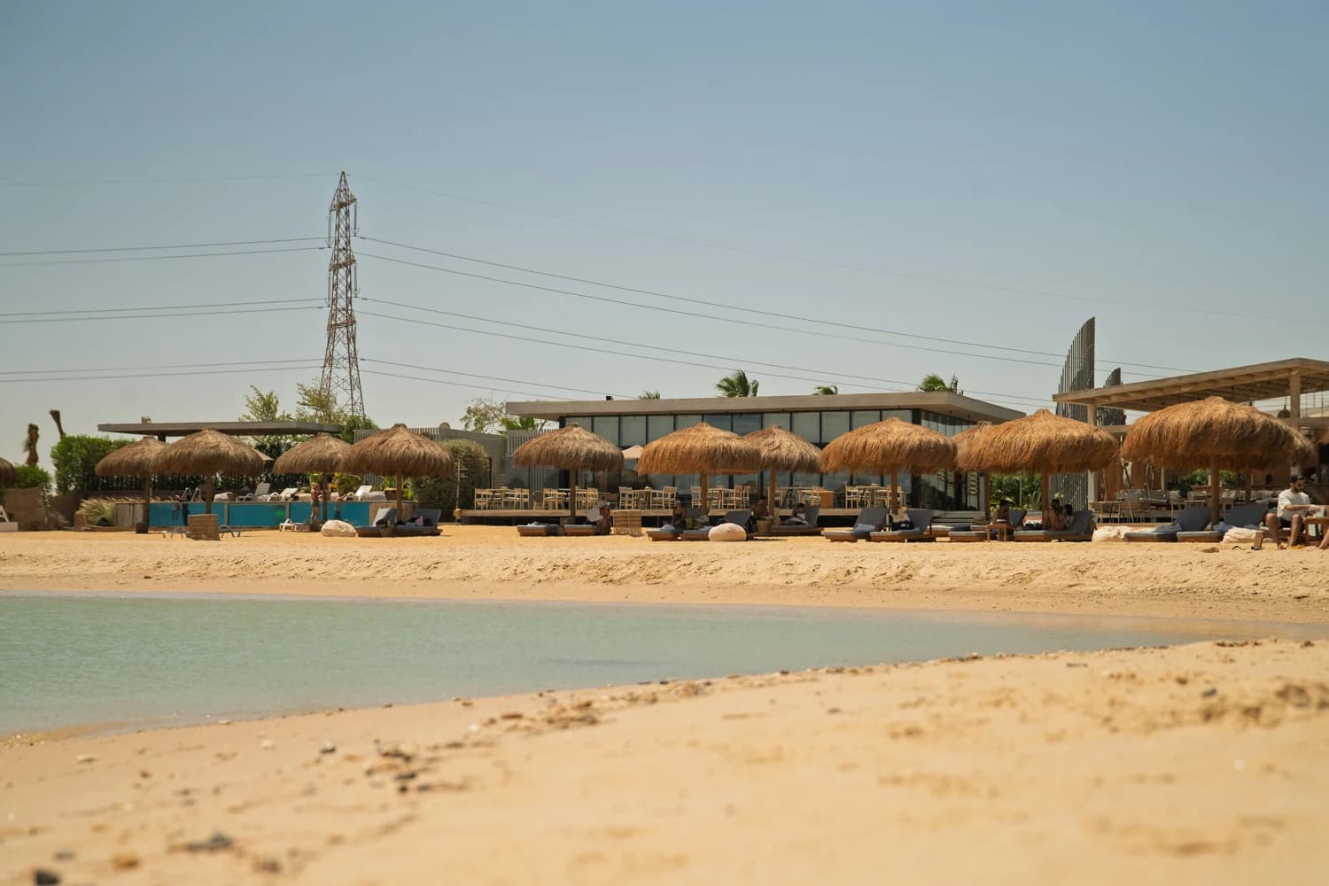 Sandy beach at Fins Sokhna with umbrellas and sun loungers