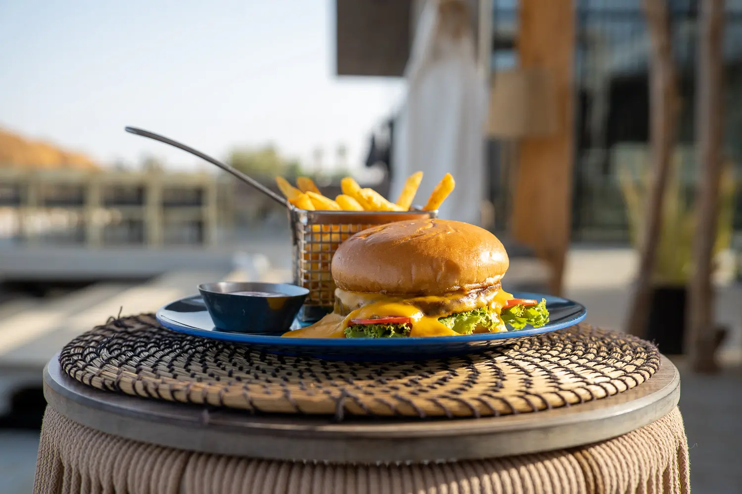 Delicious food options at Fins Sokhna restaurant including burgers, pizza, and salads